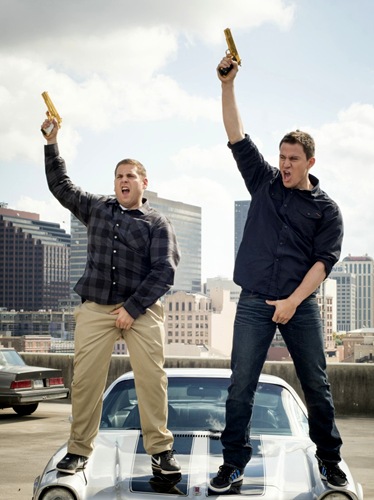 Jonah Hill and Channing Tatum wave their guns around in 22 Jump Street