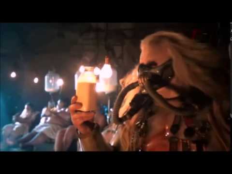 Immortan Joe sampling the goods with milk mothers and their machines in the background